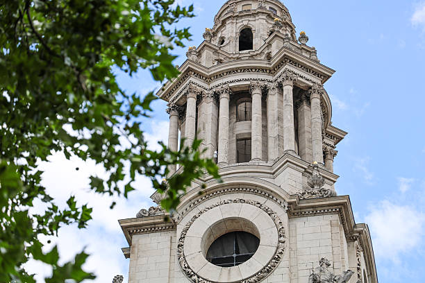 Photograph of St Paul’s Cathedral in London, captured in bright summer daylight. Clear skies illuminate the cathedral’s iconic dome and neoclassical architecture, highlighting intricate details and its status as one of London’s most historic landmarks.