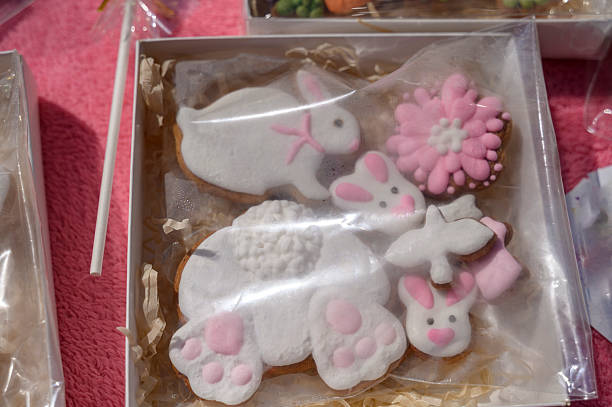 Top view of homemade Easter ginger cookies in the shape of Easter bunny, eggs and flower isolated on a white background with copy space. Easter tradition food , flat lay.