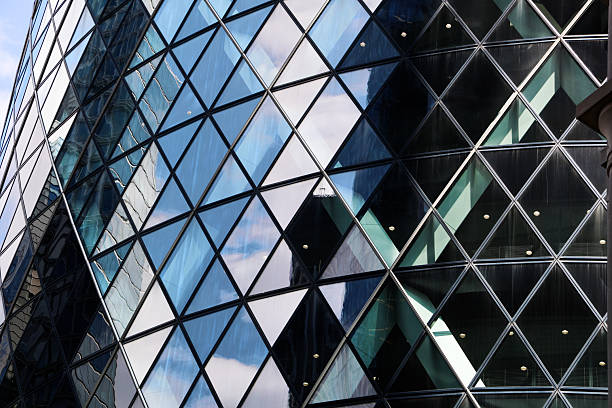 Modern office building in London, windows with reflections