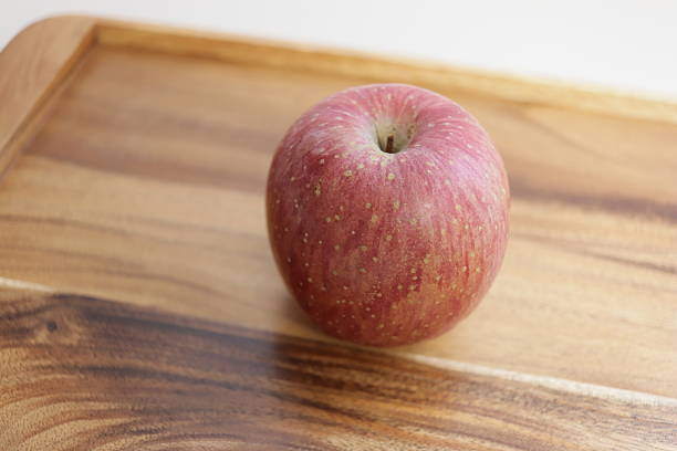A nice big red apple on the table
