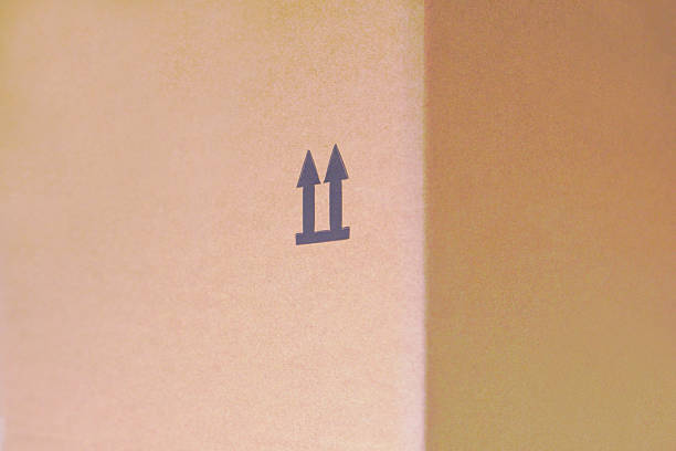 arrow on cardboard, packaging carton