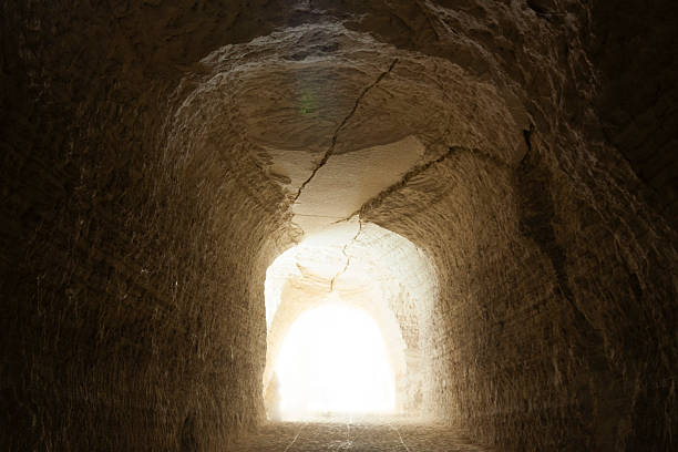 istock Dark stone corridor opening to bright exit  chalk mines Mexico 2257062192