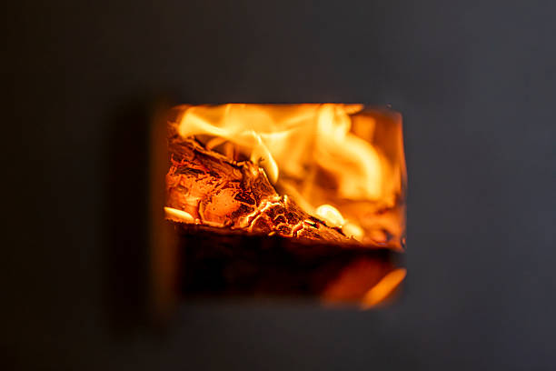 Burning firewood inside a traditional wood stove