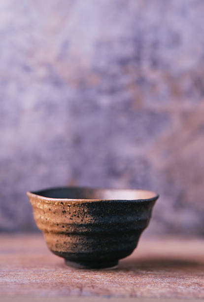 Traditional japanese ceramic on rustic wooden background. Soft focus. Copy space.