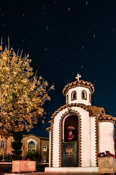 A night image with a small Greek Orthodox chapel
