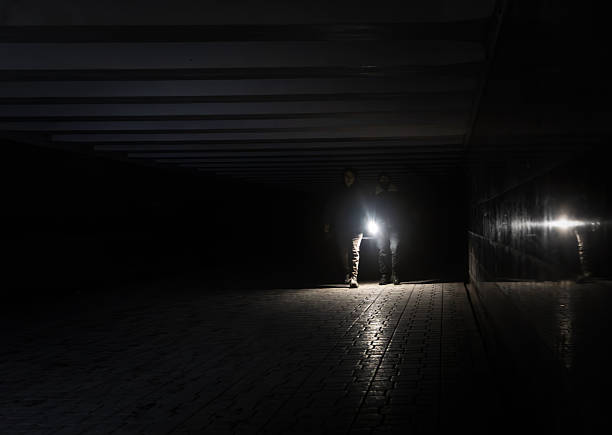 Lonely man silhouette against backdrop of foggy night city