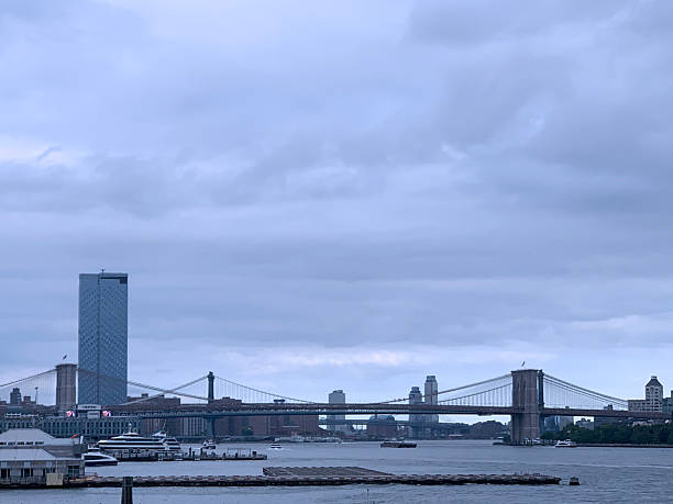 Two famous bridges, the Brooklyn and the Manhattan, cross the East River, New York City.