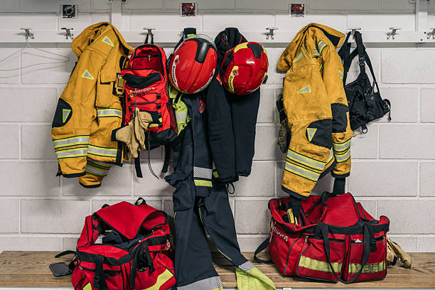 istock Firefighter equipment hanging in fire station locker room 2257090552