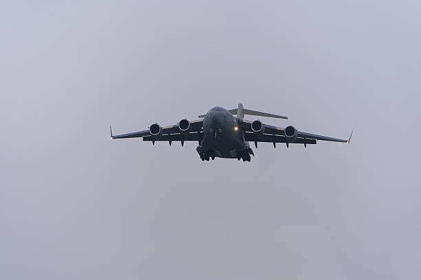 U.S. Air Force cargo airplane type Boeing C-17A Globemaster III registration AMC 88197 landing at Swiss Zürich Airport on a foggy winter day. Photo taken January 19th, 2026, Zurich, Switzerland.