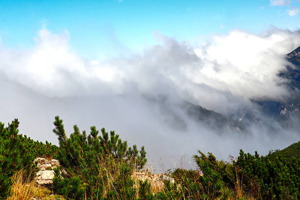 Mountain Peaks with the Clouds above