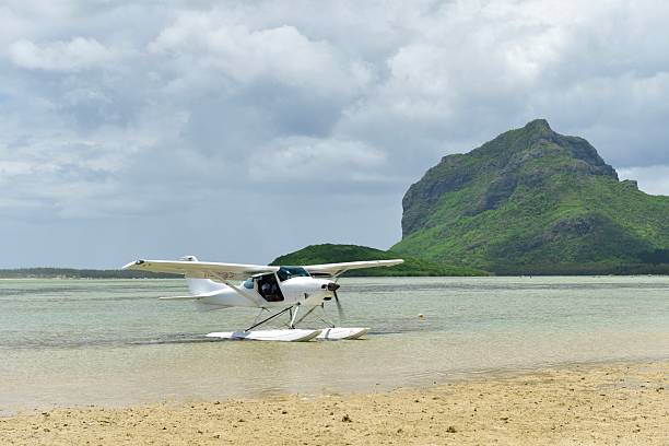 1st flights of the day, by local business Lagoon Flight which flies North then around La Morne Brabant for 30 minutes. Editorial.