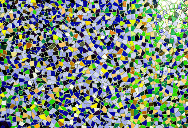 Beautiful green and beige mosaic tiles detail texture on the ground.