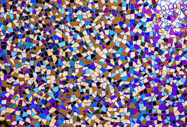 Colorful mosaic tile pattern made from ceramic fragments creating abstract decorative textured surface