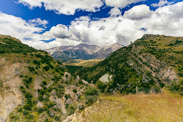 Remote highland terrain under bright summer clouds landscape nature wilderness