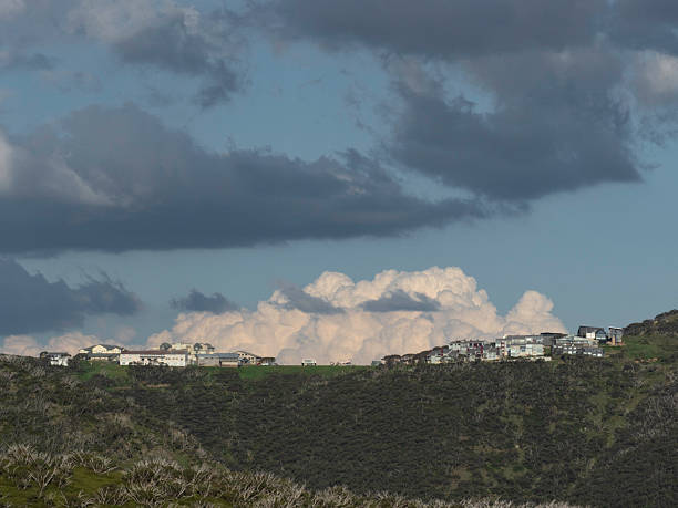 Hotham Heights perched on a hill with the big storm cloud in the background