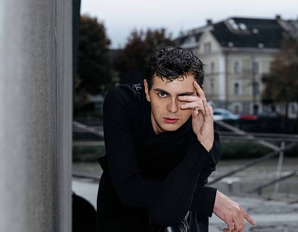 Young caucasian male with expression in urban setting