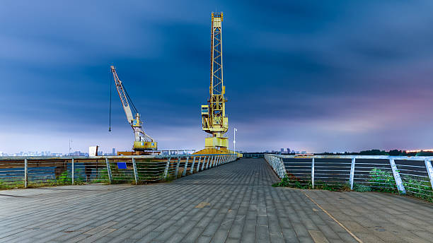 Commercial dock crane with a spectacular night sky and clouds