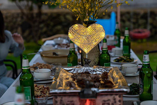 View of picnic table full of food on a terrace.