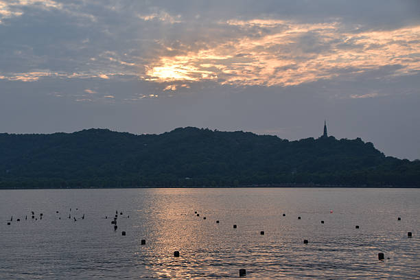 Sunset at West Lake in Hangzhou, China, with Reflection on the Water