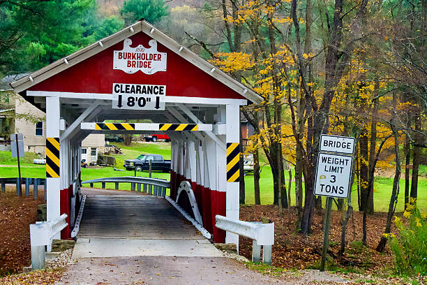 Garrett, Pennsylvania, USA - October 19, 2025: The historic Burkholder Bridge crosses Buffalo Creek in Somerset County in Southwest Pennsylvania.