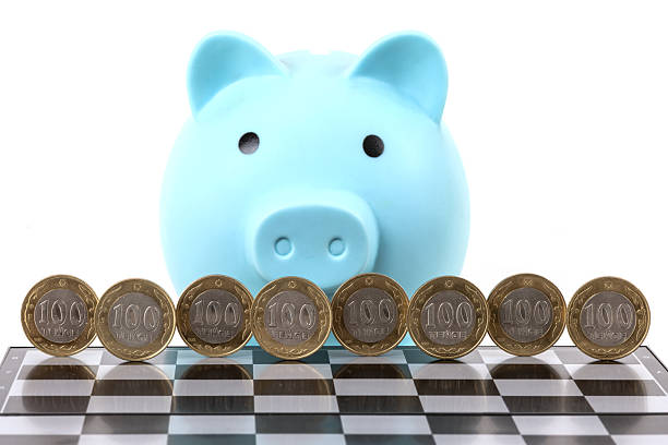 Coins worth 100 Kazakhstani tenge on a chessboard