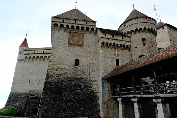 Gruyeres Castle entrance bastion and stone wall fortifications in autumn. Gruyeres, Canton of Fribourg, Switzerland.