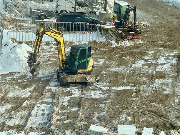 Construction site with tractors and earthworks in Tallinn, January 14, 2026