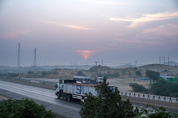 Blue Industrial Tank Truck driving on the road