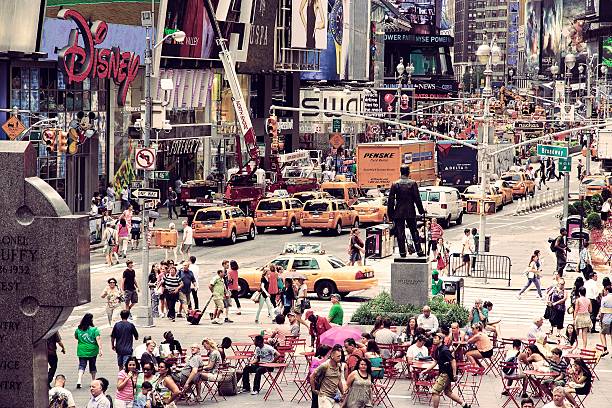People visit Times Square in New York. Times Square is one of most recognized landmarks in the world. More than 300,000 people pass through Times Square daily.