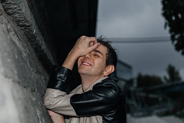 Young caucasian male with expression in urban setting