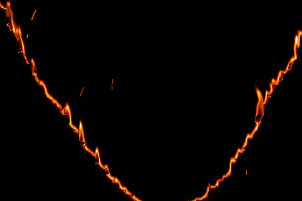 burning paper, glowing edge of paper on a black background.