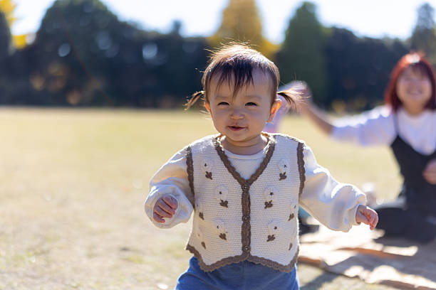 Little girl running in public park