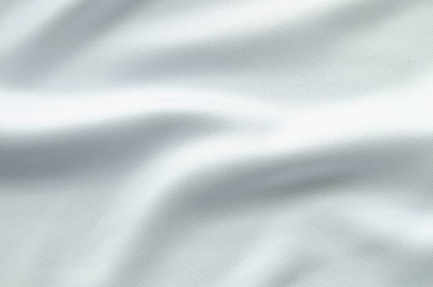 istock Soft white silky fabric texture with subtle folds for clean abstract design backgrounds. 2257201938