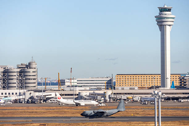 Multiple grounded airplanes parked on the runway just before sunset. Worldwide the airline industry has been taking a hard financially hit due to the Covid - 19, Corona Virus Pandemic.