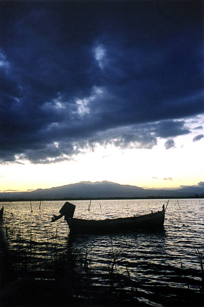 Boat moored on the Etang de Canet at dusk in the Pyrenees-Orientales department of France