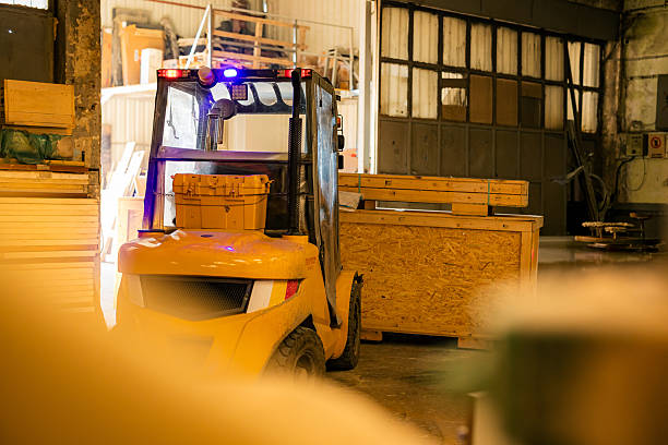 Forklift are loading into cargo containers at warehouses, ports, freight forwarding, cargo supply chains, cargo transportation, warehouse industry, logistics.