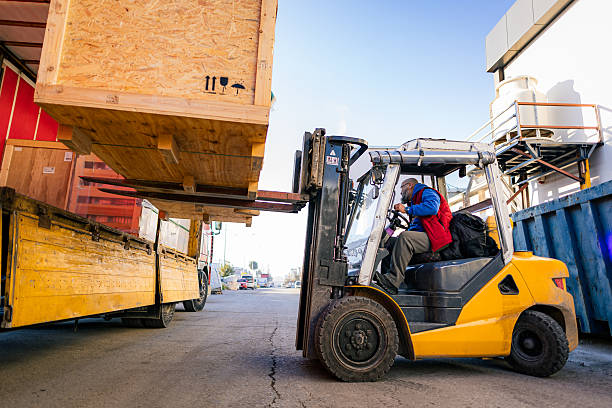 Forklift driver in a warehouse for industrial goods