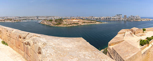 Valletta, Malta, 05 July, 2013 : View from tourist boat of watchtower on fortress wall of Fort St Angelo in Birgu city in ​​Malta