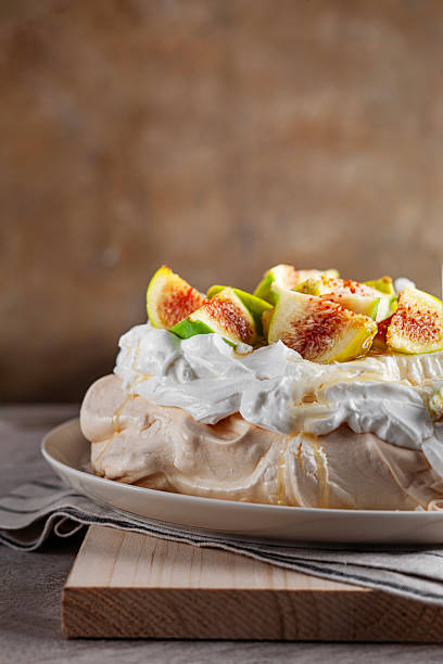 Pavlova Dessert topped with Fresh Figs and Honey Drizzle