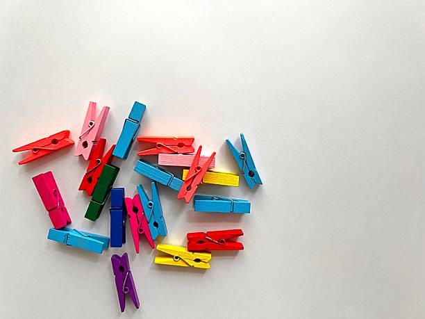 rainbow colored wooden clothespins background, household concept. High quality photo
