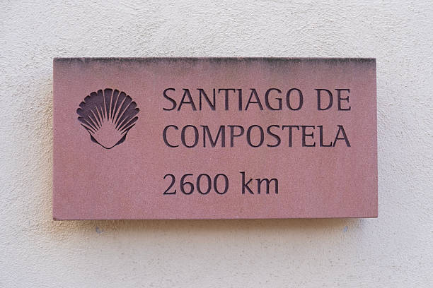 shell scallop signs path to santiago de compostela on st james pilgrimage route, 2600 km from historic city Karlsdorf in Baden-Württemberg, Karlsdorf-Neuthard, Germany
