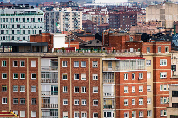 detail of multiple homes in tall buildings in a city
