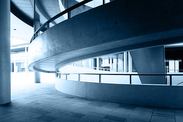 The curved hallway and escalator in a modern building