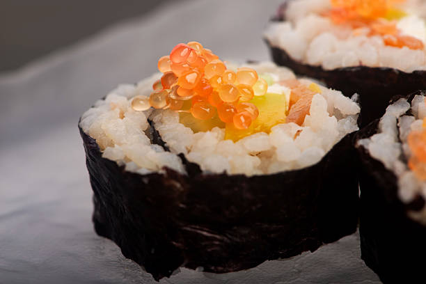 home made food avocado sushi rolls on kitchen table white rustic background environment interior space