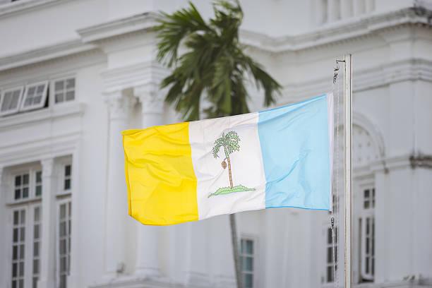 Penang State Flag on pool with historical building background.Penang Island - Malaysia.