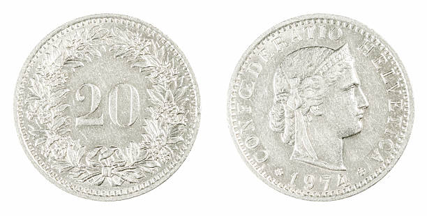Vintage Swiss 20 rappen coin from 1974 featuring the Helvetia head with Latin inscription and a floral wreath surrounding the denomination, isolated on white background.