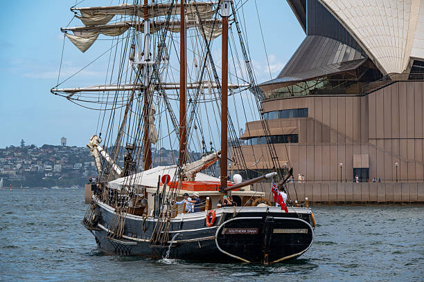 Sydney, NSW, Australia - November 29, 2025:Close-up of the tall ship Southern Swan sailing in Sydney Harbor. The Sydney Opera House is in the background.