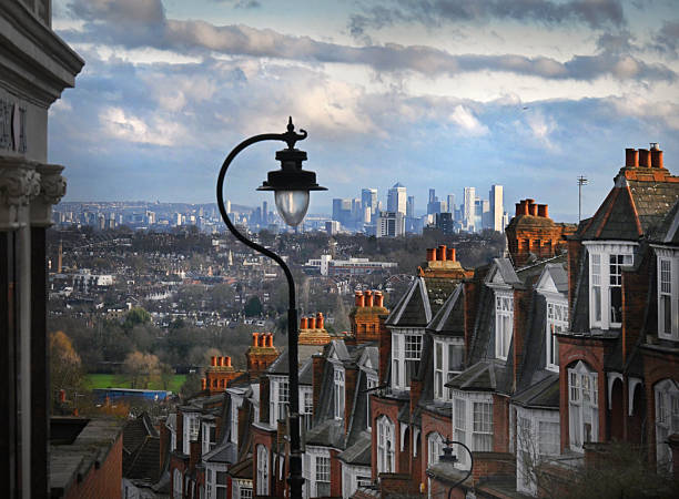 Suburban North London homes in Muswell Hill looking towards Crouch End and the distant skyscraper offices at Canary Wharf