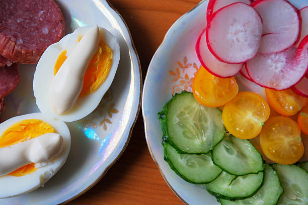 Brightly colored vegetables and perfectly prepared eggs create a delightful snack.