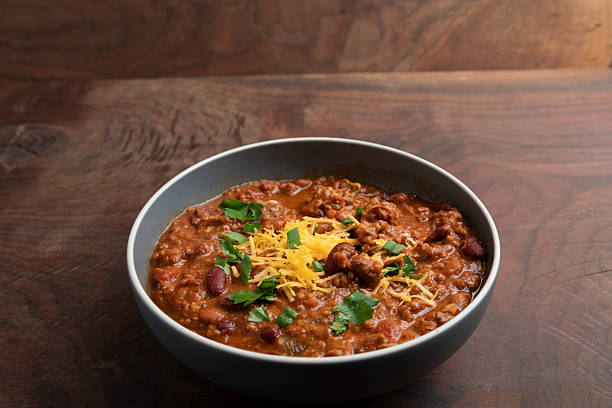 Ladle the meat stew with vegetables into a bowl